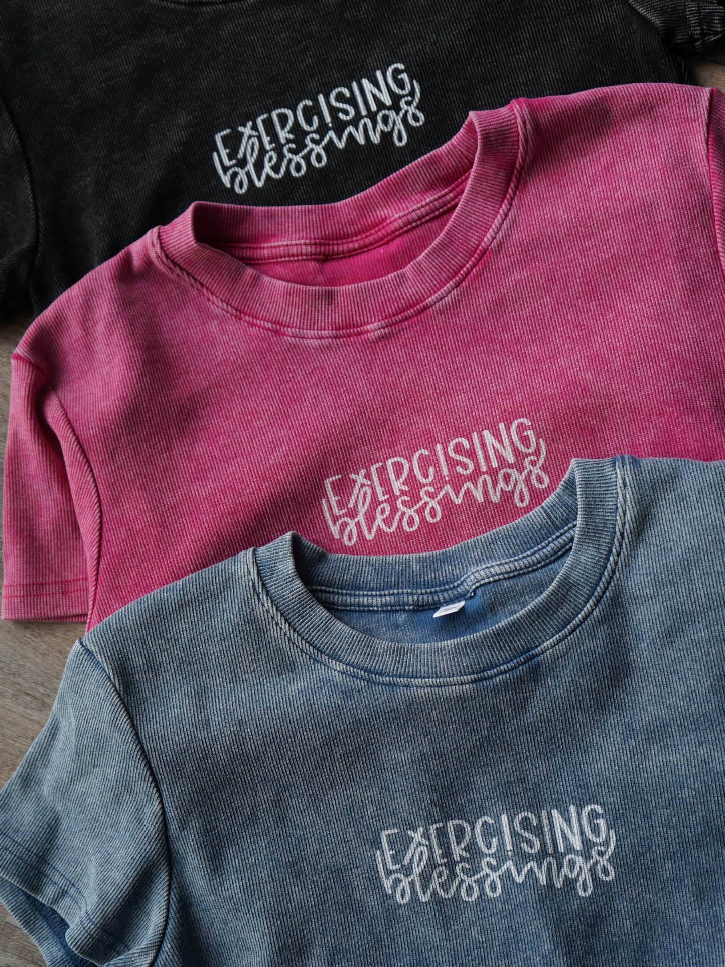 Three shirts in different colors with 'Exercising Blessings' text.